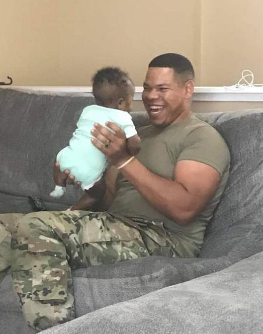 Keontra Campbell playing with his daughter Lailah, 2019